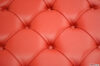 Red leather square capitonné