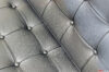 Seams and buttons in the leather of the barcelona armchair