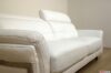 White leather armrest detail with steel detail