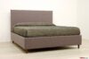 Bed with high wooden feet