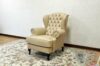Beige leather capitonné bergere armchair