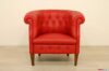 Classic armchair with high wooden feet