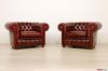 Red capitonné Chesterfield armchairs with buttons