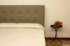 Headboard bed in modern taupe leather with stitched checks