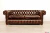 Vintage brown Chesterfield sofa with nails