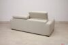 Modern sofa with raised headrest seen from behind