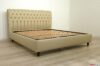Chesterfield bed in taupe leather with high feet