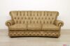 Capitonné sofa with high back in leather