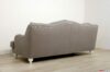 Back of sofa with exposed feet
