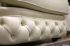 Luxury buttoned leather armchair cream color
