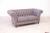 Chester style capitonné sofa with high feet