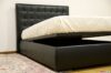 bed with quilted headboard