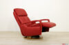 Armchair with built-in reclining footrest