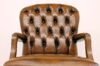 Upholstered capitonné back of office chair