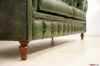 Wooden foot of chesterfield sofa high from the floor