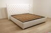 Capitonné bed with high headboard in white faux leather